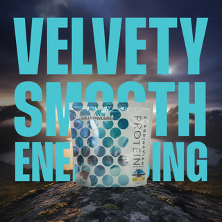 WillPowders Milk Chocolate Protein Powder with Shilajit, Monocreatine and Scandinavian Bone Broth pouch with 'Velvety Smooth' text overlay on a Scandinavian mountain background