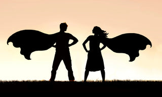 Silhouette of two superheros