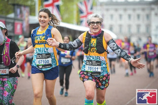 Image of two people, Emily and Rachael, running the London Marathon