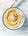 a bowl of hummus on a plain background 