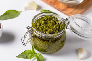 A jar or parsley and pumpkin pesto