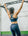 Woman strength training doing pull ups