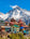 Himalayan mountain backdrop with colourful houses in front