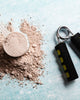 Protein powder and gym equipment on a blue background