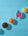 Pots of different coloured powders on a blue background 