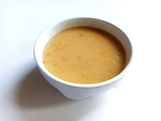 Soup in a white bowl on a white background