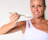 Davinia Taylor holding an iridescent spoon with bovine collagen