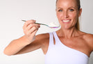 Davinia Taylor holding an iridescent spoon with bovine collagen