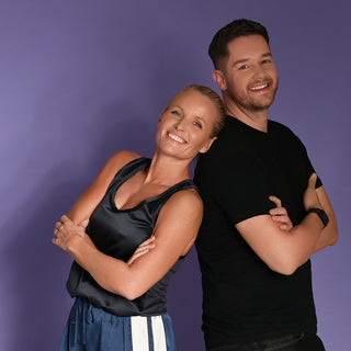 Willpowders founder Davinia Taylor and Chef Dan Kirkham standing back to back against a purple background