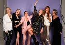 Davinia Taylor with WillPowder customers against a purple background