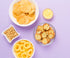 An assortment of snacks on a purple background