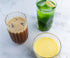 3 glasses of detox drinks; one contains iced coffee, one contains a turmeric drink, one contains a green drink with a lemon slice