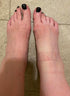 Two feet on tiled floor