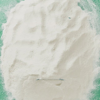 GIF showing a pile of madagascan vanilla with celtic sea salt protein powder being moved aside to reveal the product pouch beneath