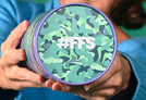 Woman holding a Protein Powder tub showing the lid with the text #FFS